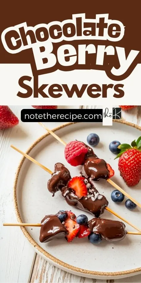 Chocolate berry skewers dipped in sugar-free chocolate with fresh strawberries, raspberries, and blueberries on a ceramic plate.