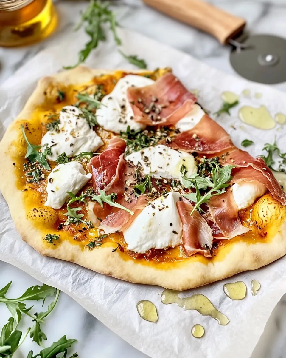 Crispy Prosciutto and Honey Burrata Pizza – Perfect Flavor Balance A rustic-style Prosciutto and Honey Burrata Pizza with a golden crispy crust, creamy burrata, delicate prosciutto, and fresh arugula, finished with a drizzle of honey.