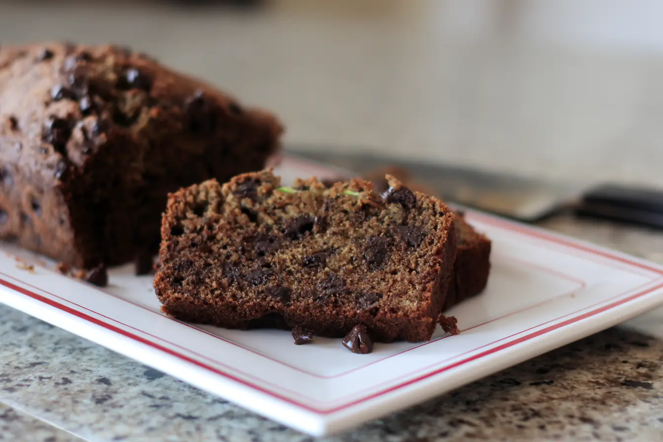 Close-up of sliced chocolate chip zucchini bread on a plate