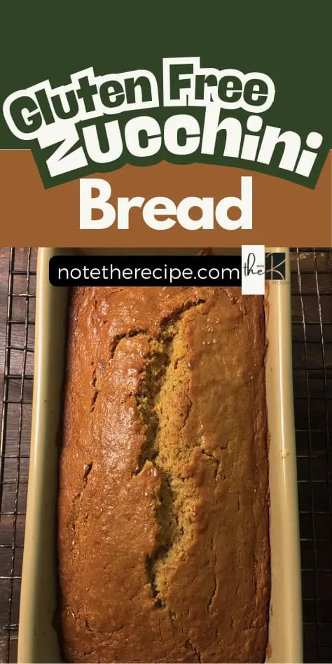 Golden gluten free zucchini bread loaf in a pan with text overlay